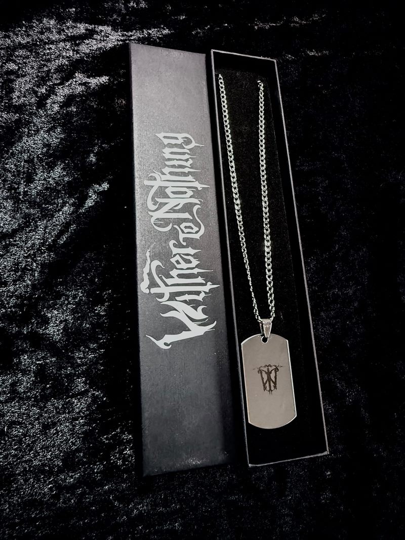 Silver dog-tag necklace engraved with the sigil, presented in its gift box